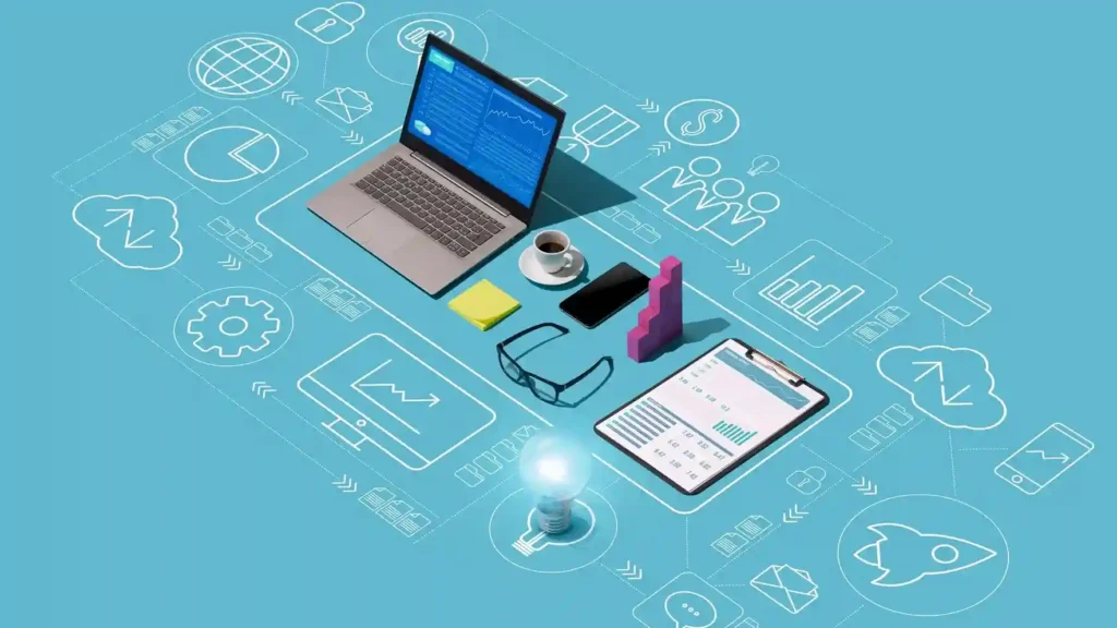 Vista superior de una estación de trabajo digital con laptop, tablet, smartphone y gráficos de datos, rodeada de íconos tecnológicos sobre un fondo azul.